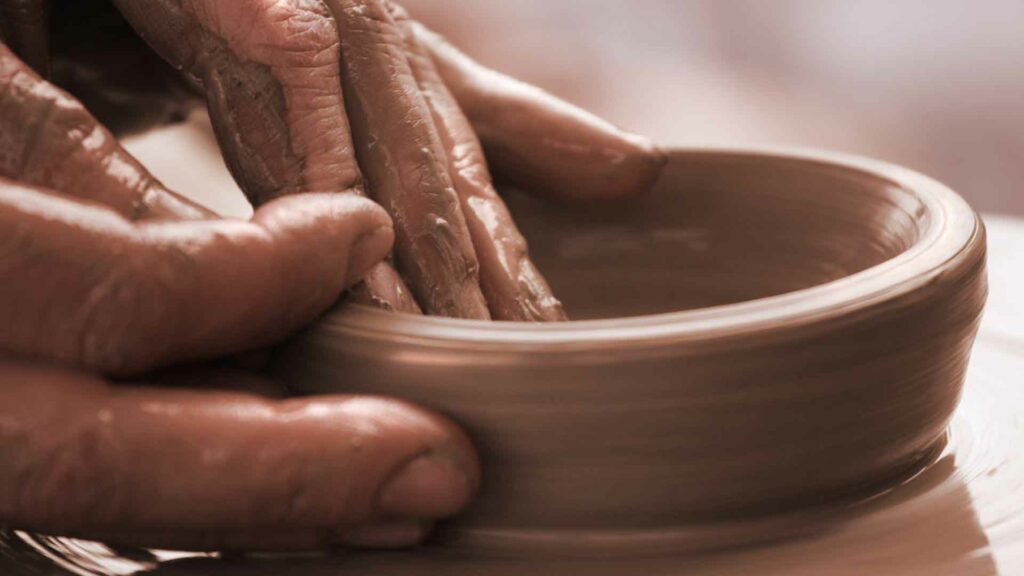 Hands moulding clay